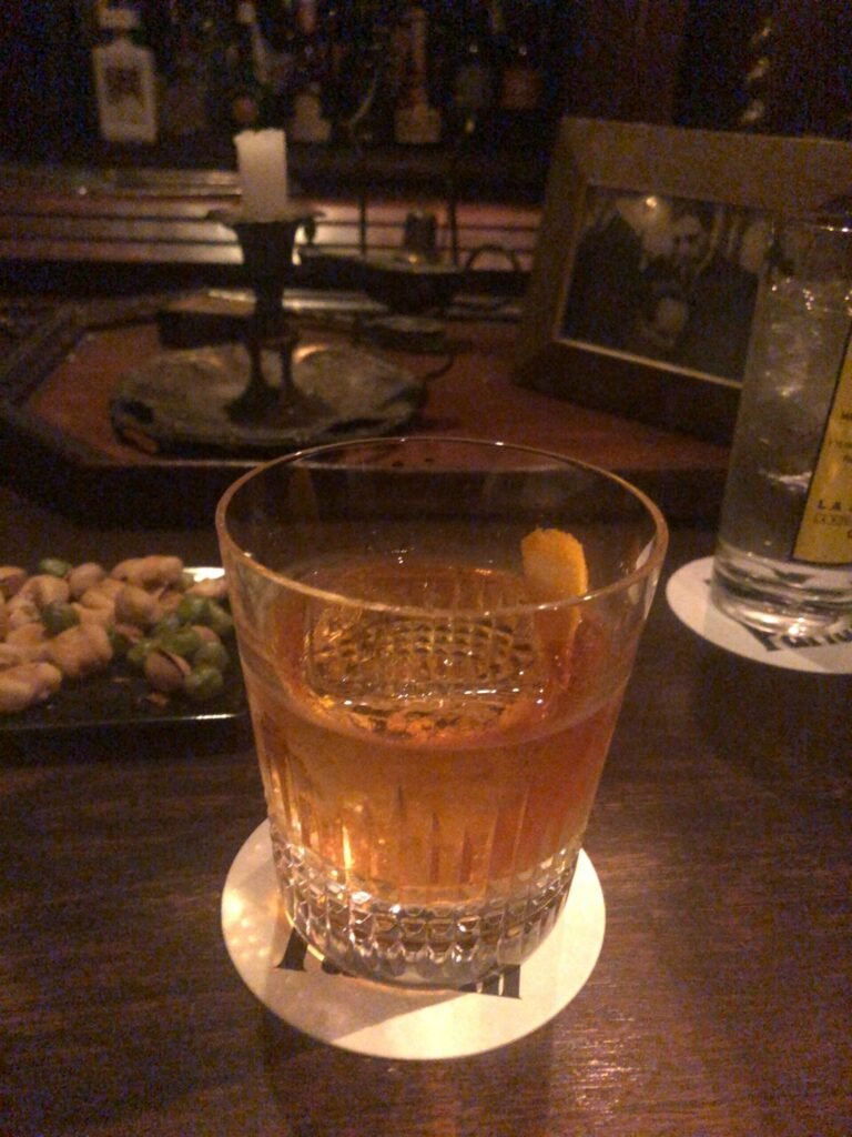 Whisky cocktail served at a tiny hidden bar, the kind found on a Golden Gai bar hopping tour